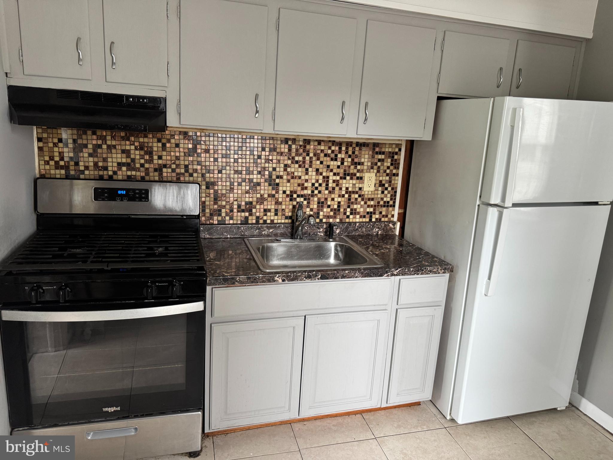 331 West Front Street, Unit 2 Florence, NJ 08518 - Photo 9 of 13 a kitchen with refrigerator and cabinets