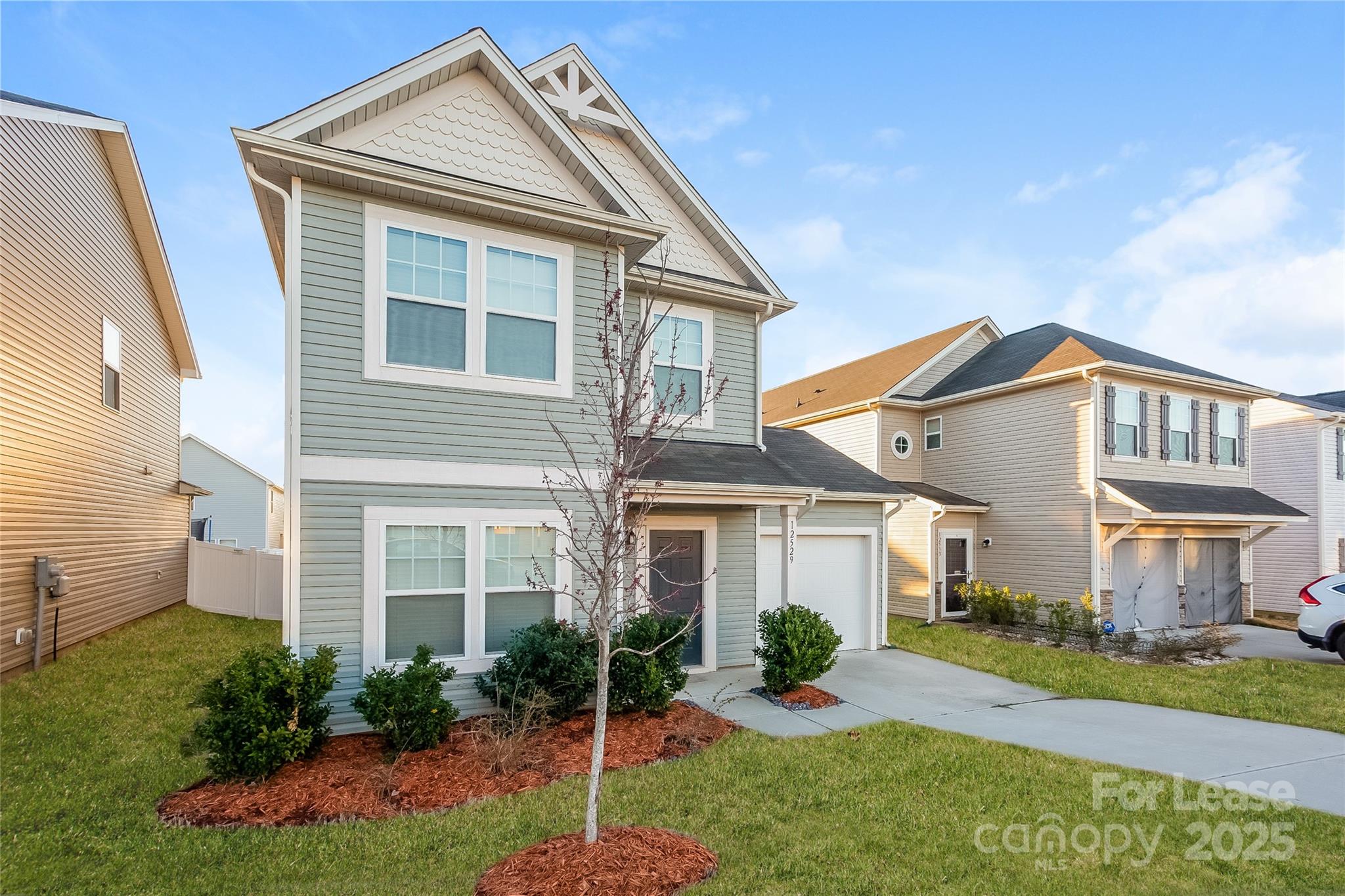 a front view of a house with a yard and porch