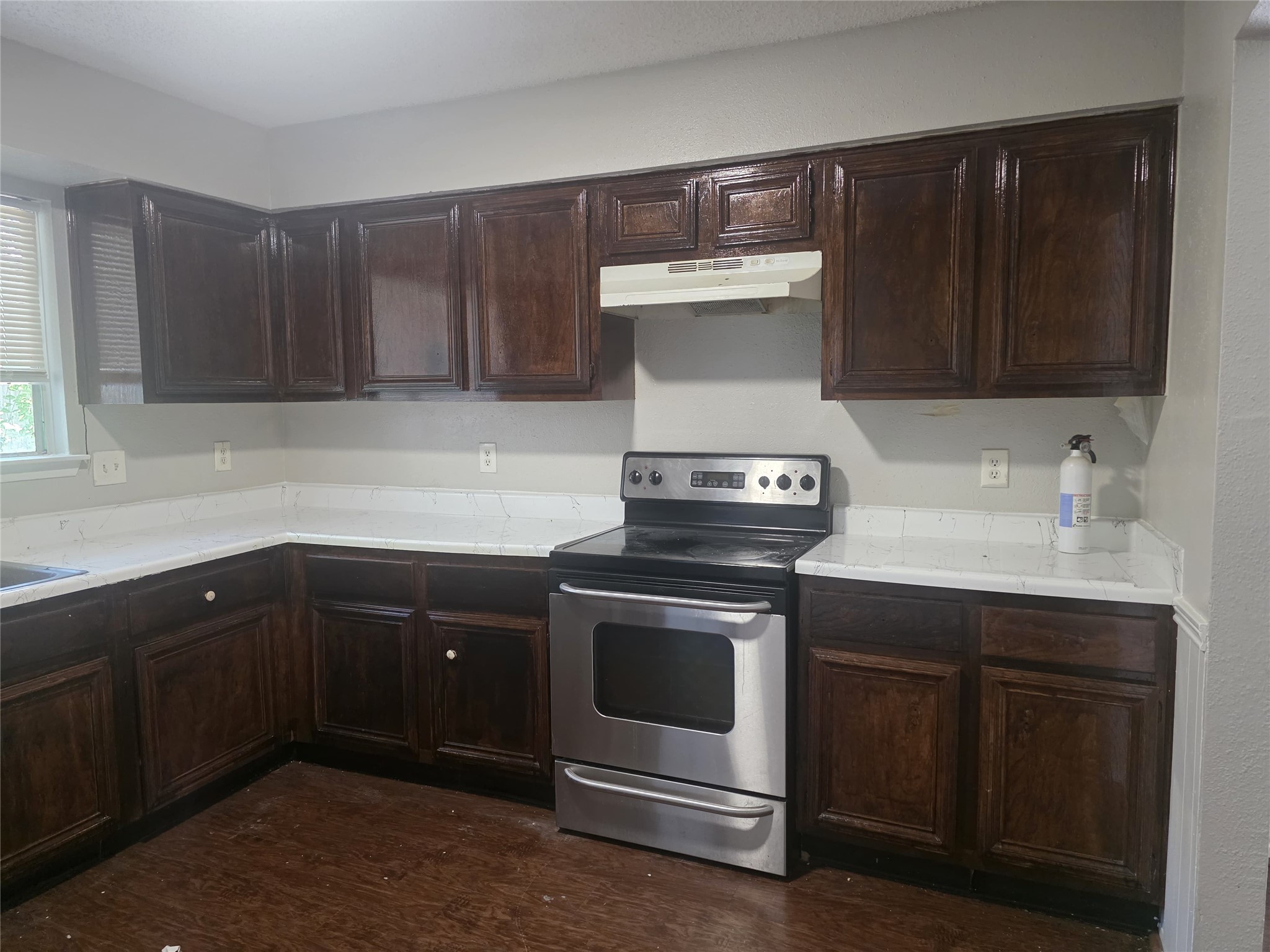 23322 Dew Wood Lane Spring, TX 77373 - Photo 10 of 20 a kitchen with a stove and a sink