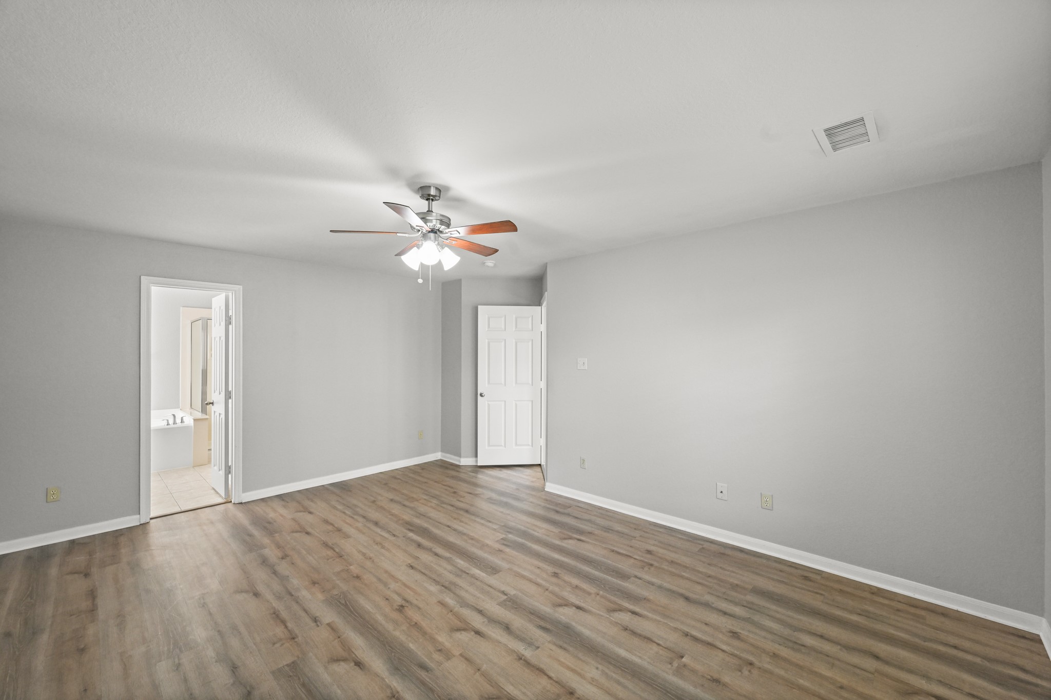 14614 Hazy Ridge Lane Cypress, TX 77429 - Photo 18 of 36 a view of an empty room with wooden floor
