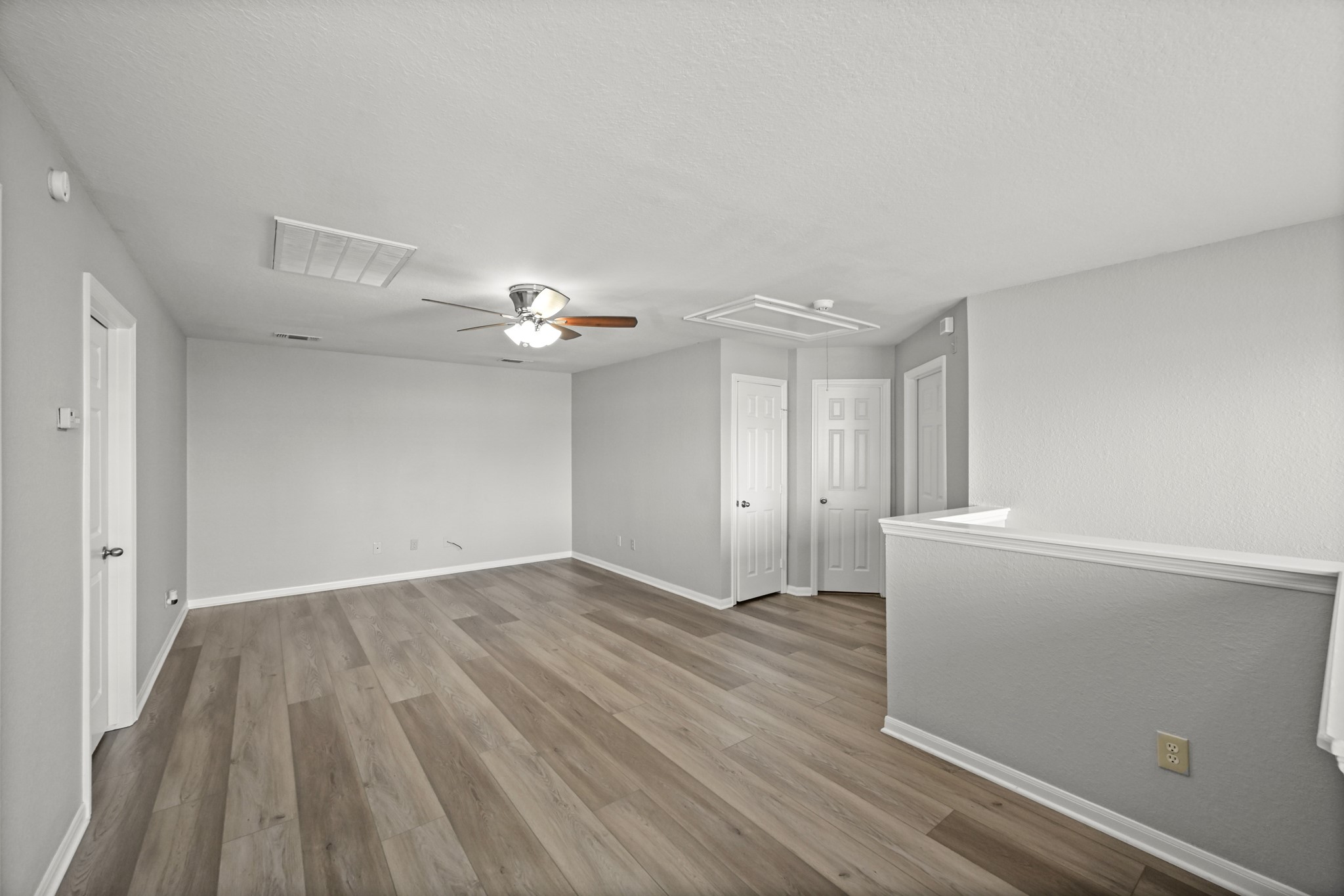 14614 Hazy Ridge Lane Cypress, TX 77429 - Photo 26 of 36 wooden floor in an empty room with a window