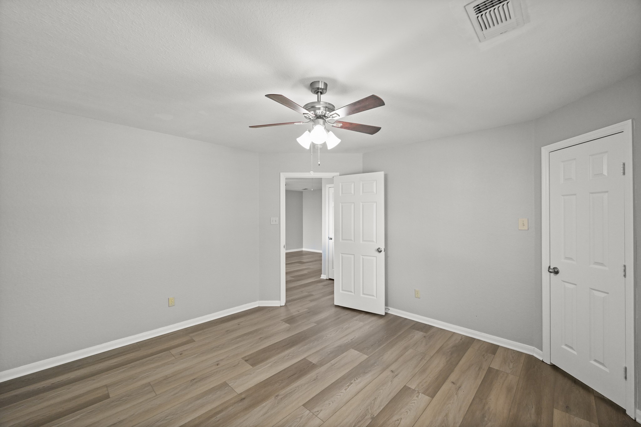 14614 Hazy Ridge Lane Cypress, TX 77429 - Photo 34 of 36 a view of an empty room with wooden floor