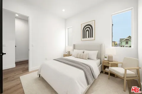 a bedroom with a bed and a couch