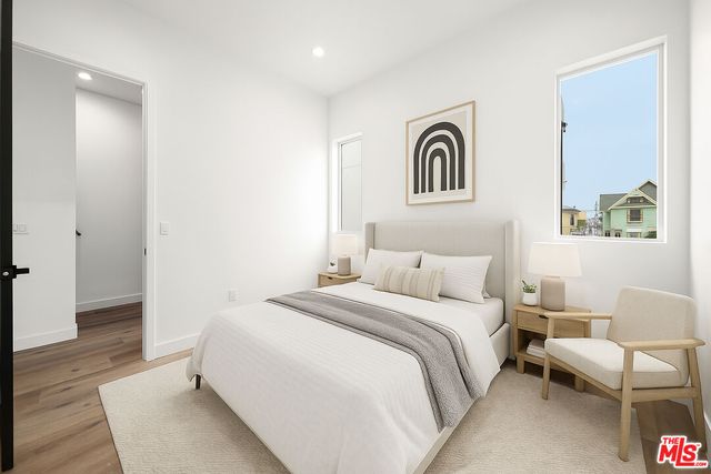 a bedroom with a bed and a couch