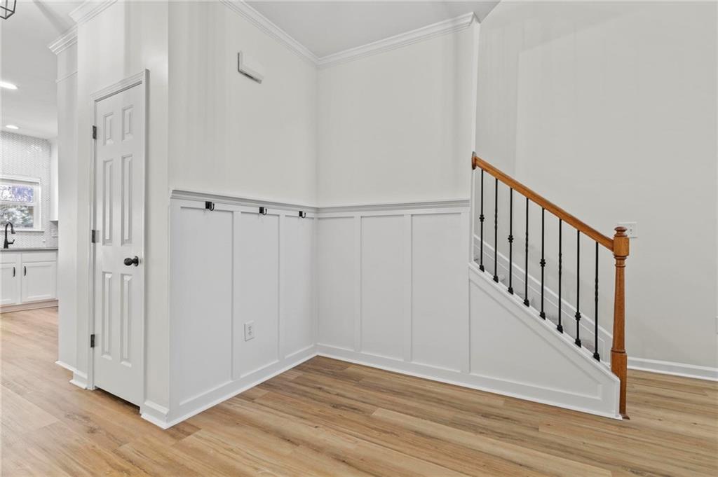 2615 Maple Leaf Terrace Cumming, GA 30041 - Photo 16 of 34 a view of a hallway with wooden floor