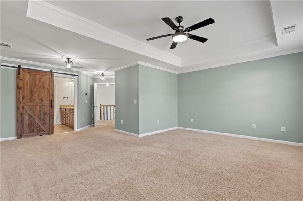 2615 Maple Leaf Terrace Cumming, GA 30041 - Photo 17 of 34 an empty room with closet and windows