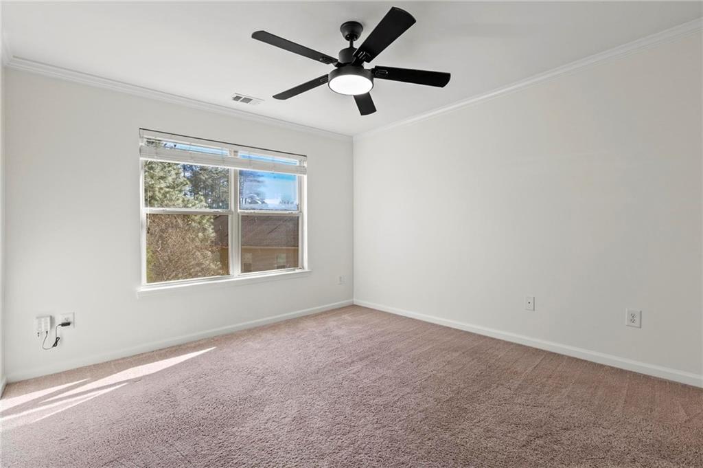 2615 Maple Leaf Terrace Cumming, GA 30041 - Photo 28 of 34 a view of an empty room with a window