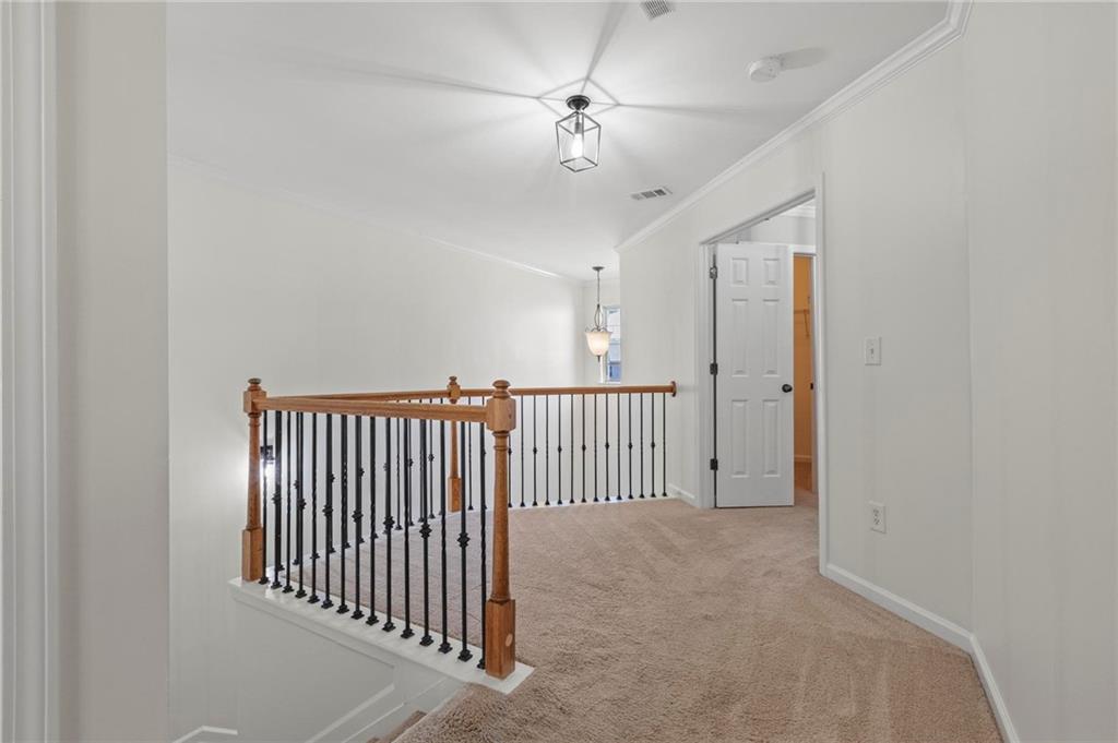 2615 Maple Leaf Terrace Cumming, GA 30041 - Photo 30 of 34 a view of a hallway with a ceiling fan