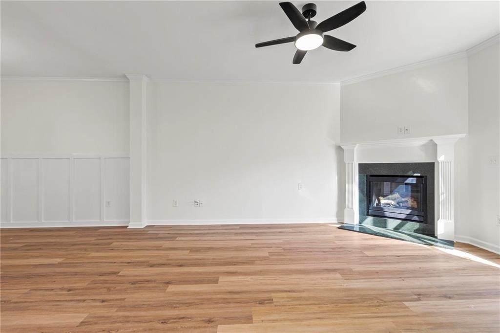 2615 Maple Leaf Terrace Cumming, GA 30041 - Photo 5 of 34 a view of empty room with wooden floor and fan