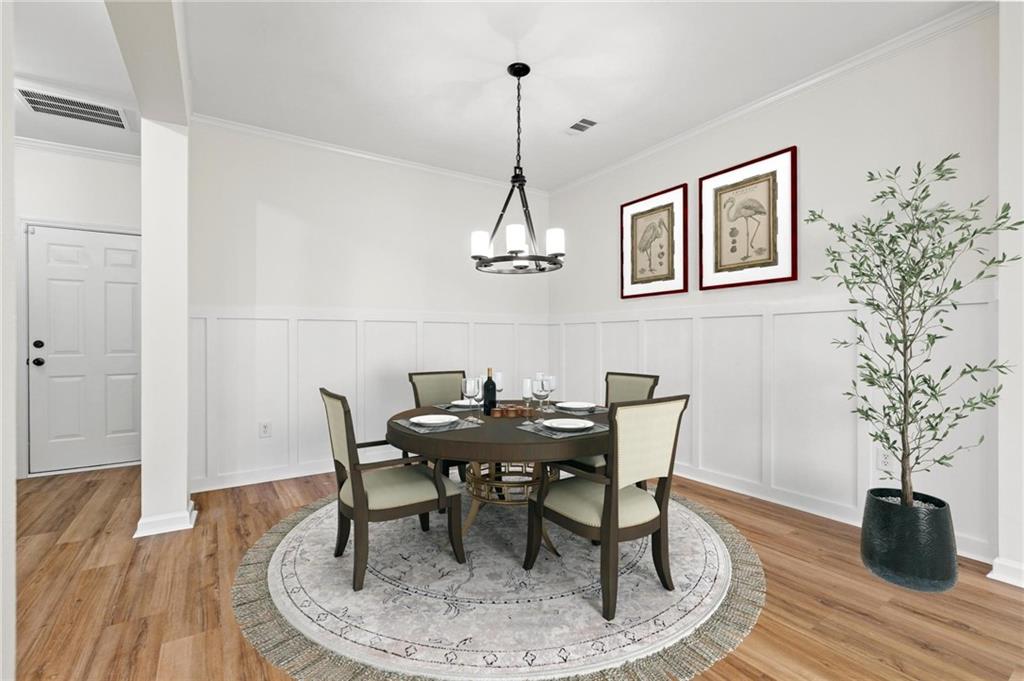 2615 Maple Leaf Terrace Cumming, GA 30041 - Photo 10 of 34 a view of a dining room with furniture and wooden floor