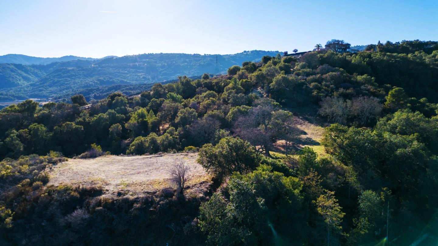 a view of a house with a mountain in the background