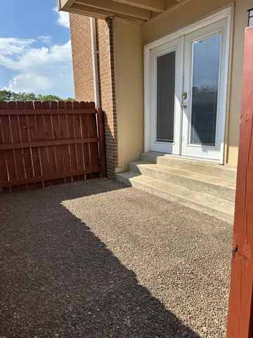 a view of a backyard of the house