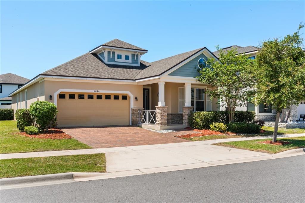 2890 Avian Loop Kissimmee, FL 34741 - Photo 1 of 1 a view of a house with a yard and plants