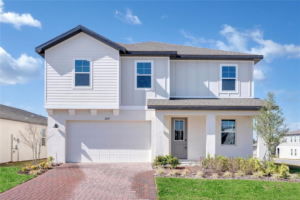 2227 Huntsman Rdg Drive Minneola, FL 34715 - Photo 1 of 1 front view of a house with a yard