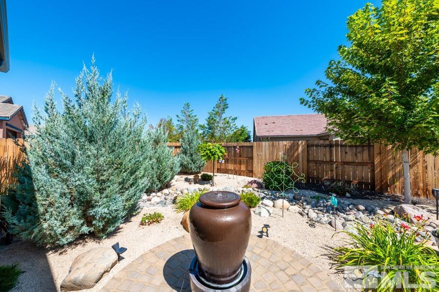 9826 Dyevera Lane Reno, NV 89521 - Photo 28 of 39 a view of a chairs and table in backyard