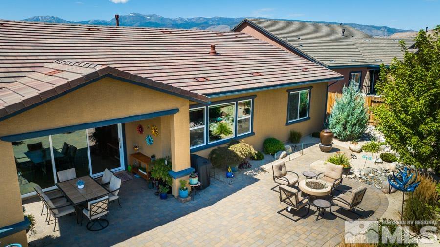 9826 Dyevera Lane Reno, NV 89521 - Photo 30 of 39 a view of backyard with a patio and outdoor seating