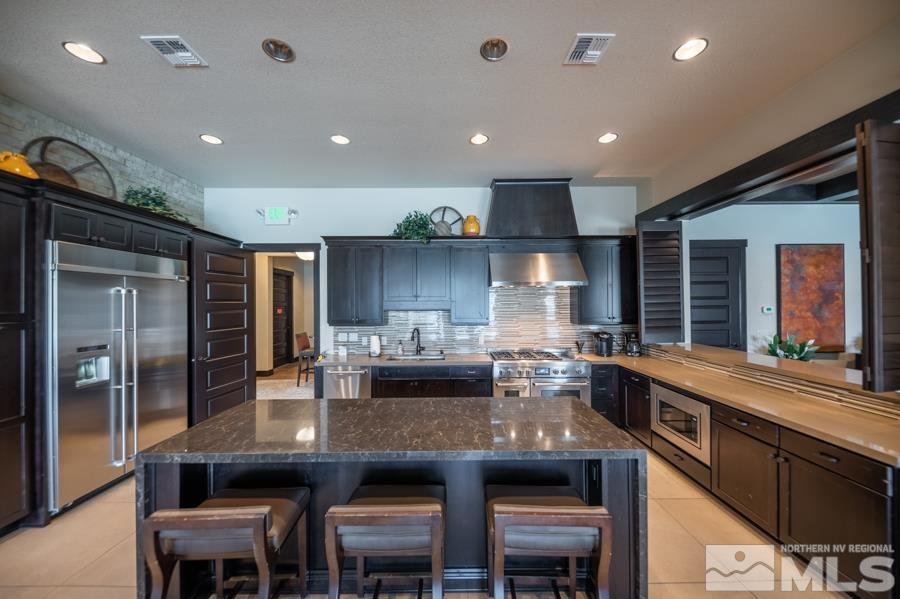 9826 Dyevera Lane Reno, NV 89521 - Photo 35 of 39 a kitchen with counter space cabinets and appliances