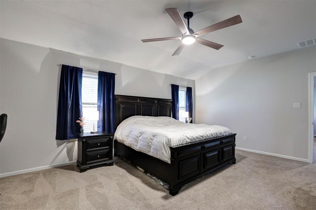 512 Amory Street Azle, TX 76020 - Photo 12 of 25 a bedroom with a bed and window