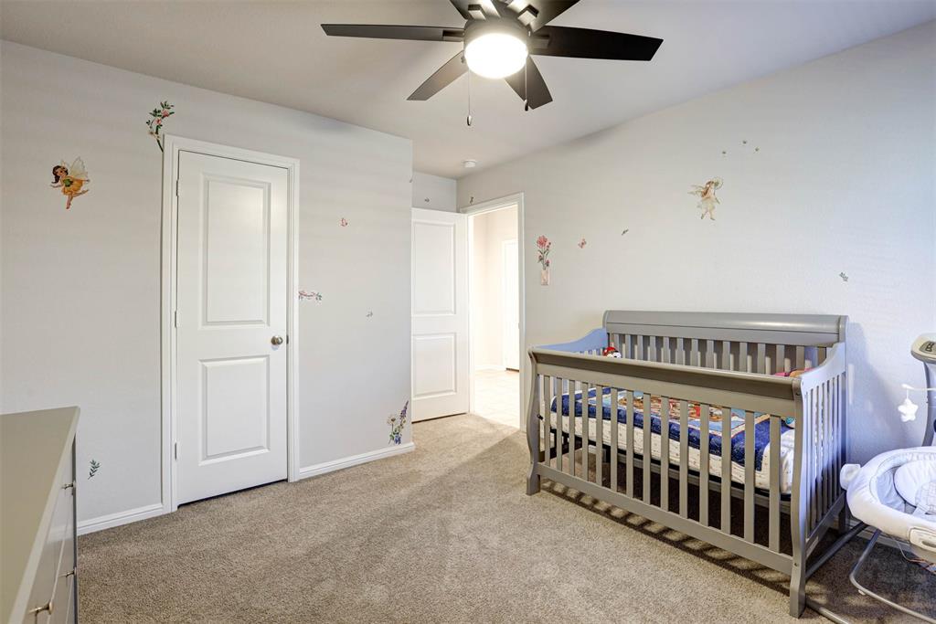 512 Amory Street Azle, TX 76020 - Photo 20 of 25 a bedroom with furniture and a window