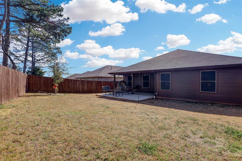 512 Amory Street Azle, TX 76020 - Photo 25 of 25 a view of a house with backyard and sitting area