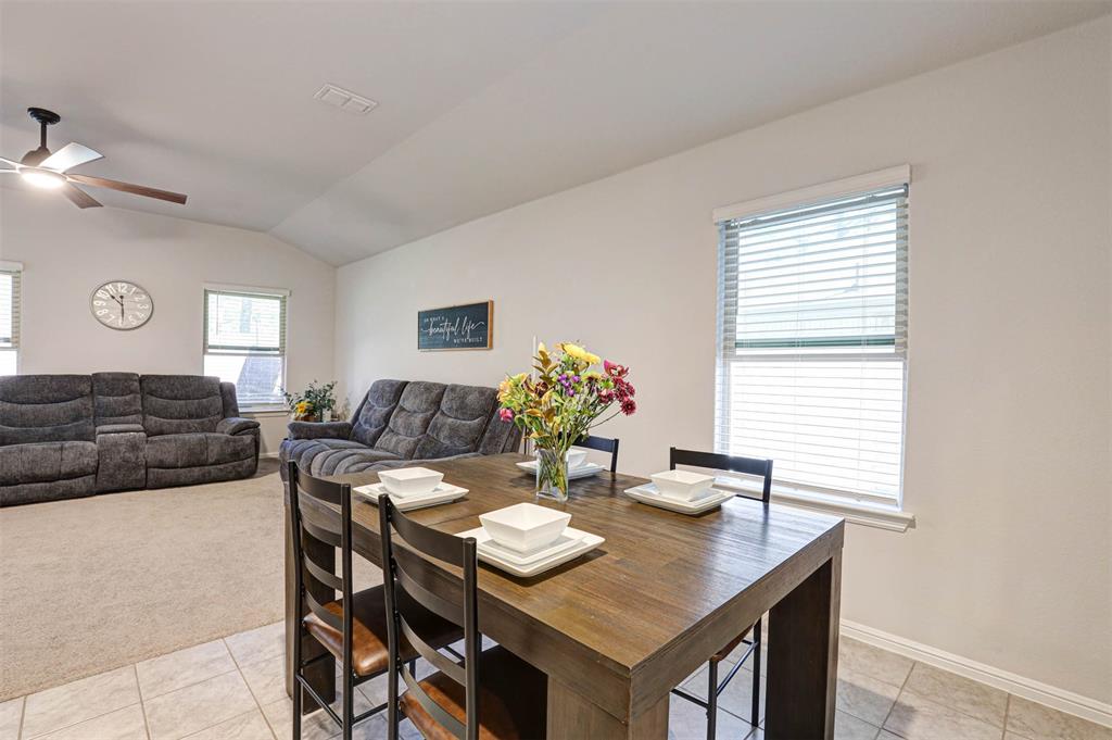 512 Amory Street Azle, TX 76020 - Photo 7 of 25 a view of a dining room with furniture and wooden floor