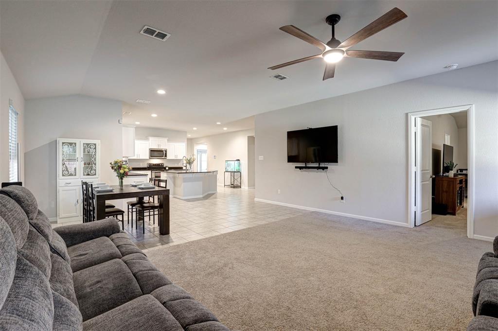 512 Amory Street Azle, TX 76020 - Photo 10 of 25 a living room with furniture and a flat screen tv