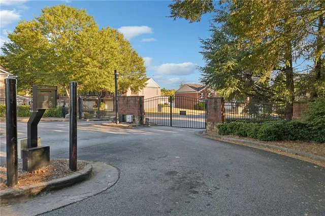 a view of a street with palm trees