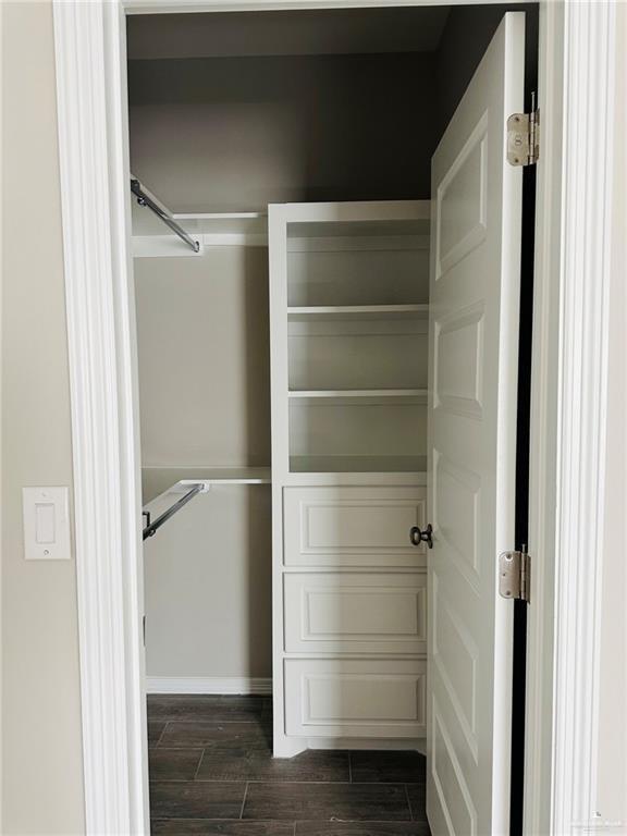 1614 Playa Drive, Unit 3 Weslaco, TX 78596 - Photo 5 of 11 a view of walk in closet with empty racks