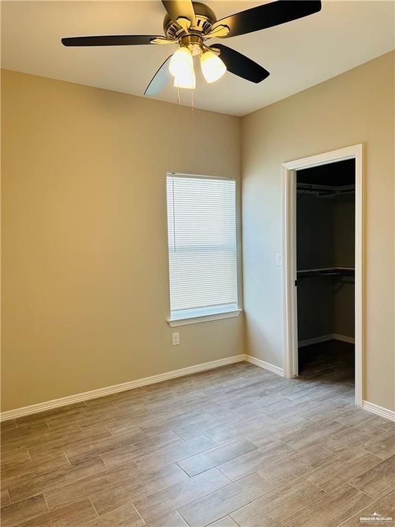 1614 Playa Drive, Unit 3 Weslaco, TX 78596 - Photo 6 of 11 an empty room with closet and fan