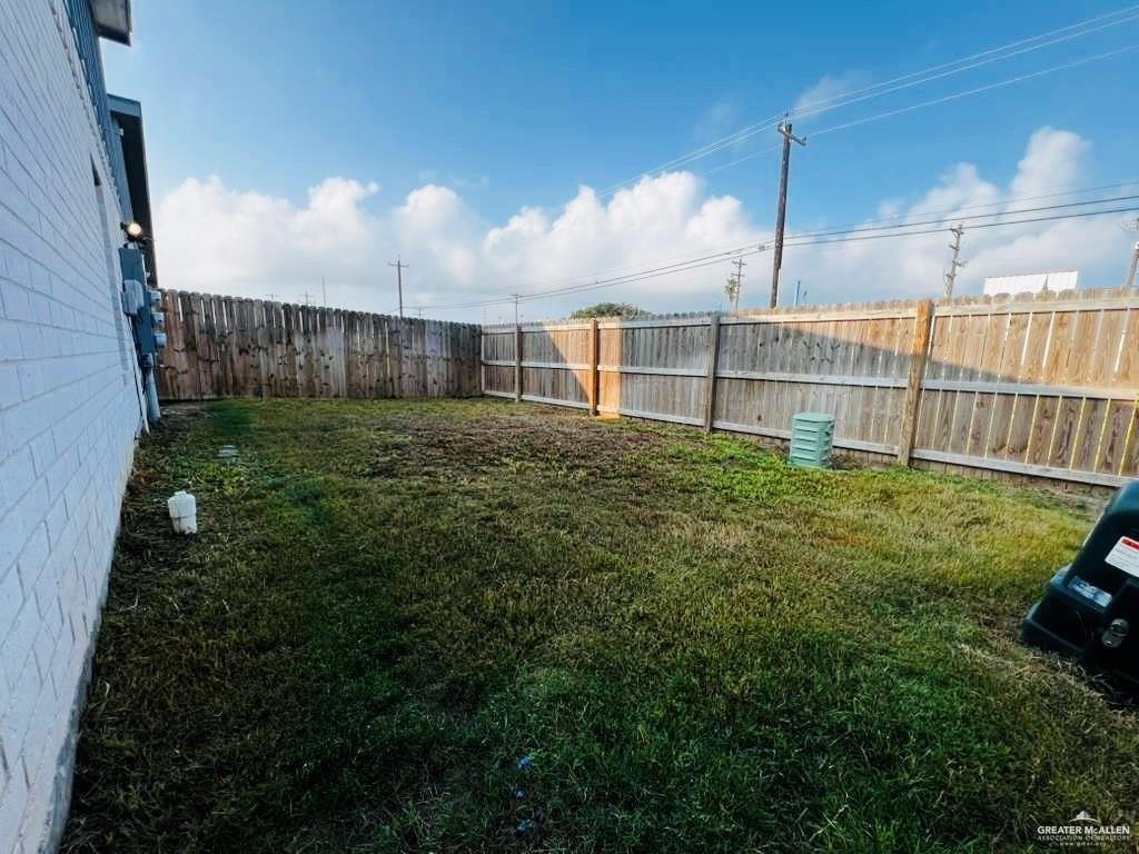 1614 Playa Drive, Unit 3 Weslaco, TX 78596 - Photo 10 of 11 a view of a backyard