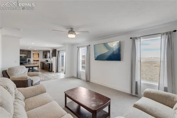 a living room with furniture and a window