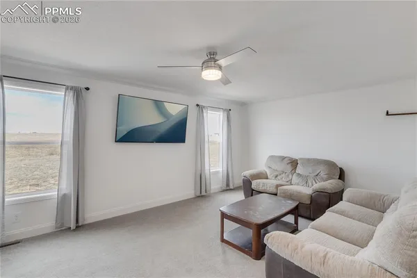 a bedroom with a bed and dresser