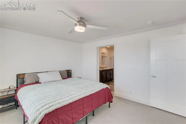 a bathroom with a granite countertop sink toilet a mirror and shower