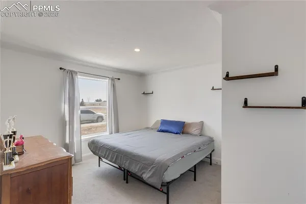 a bathroom with a granite countertop sink a toilet and shower