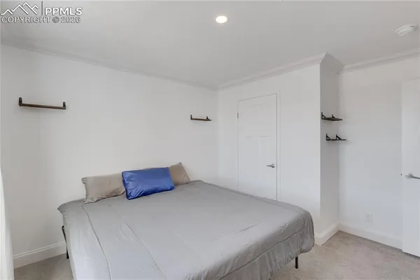 a view of a livingroom with furniture and a window