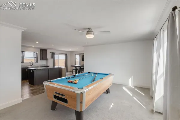 a living room with kitchen furniture and kitchen view