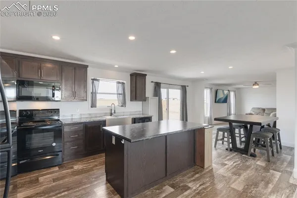 a view of kitchen island with lounge chair