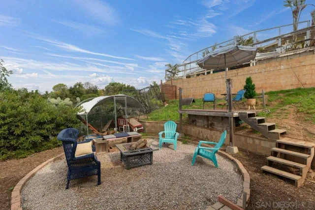 a view of a patio with a table and chairs