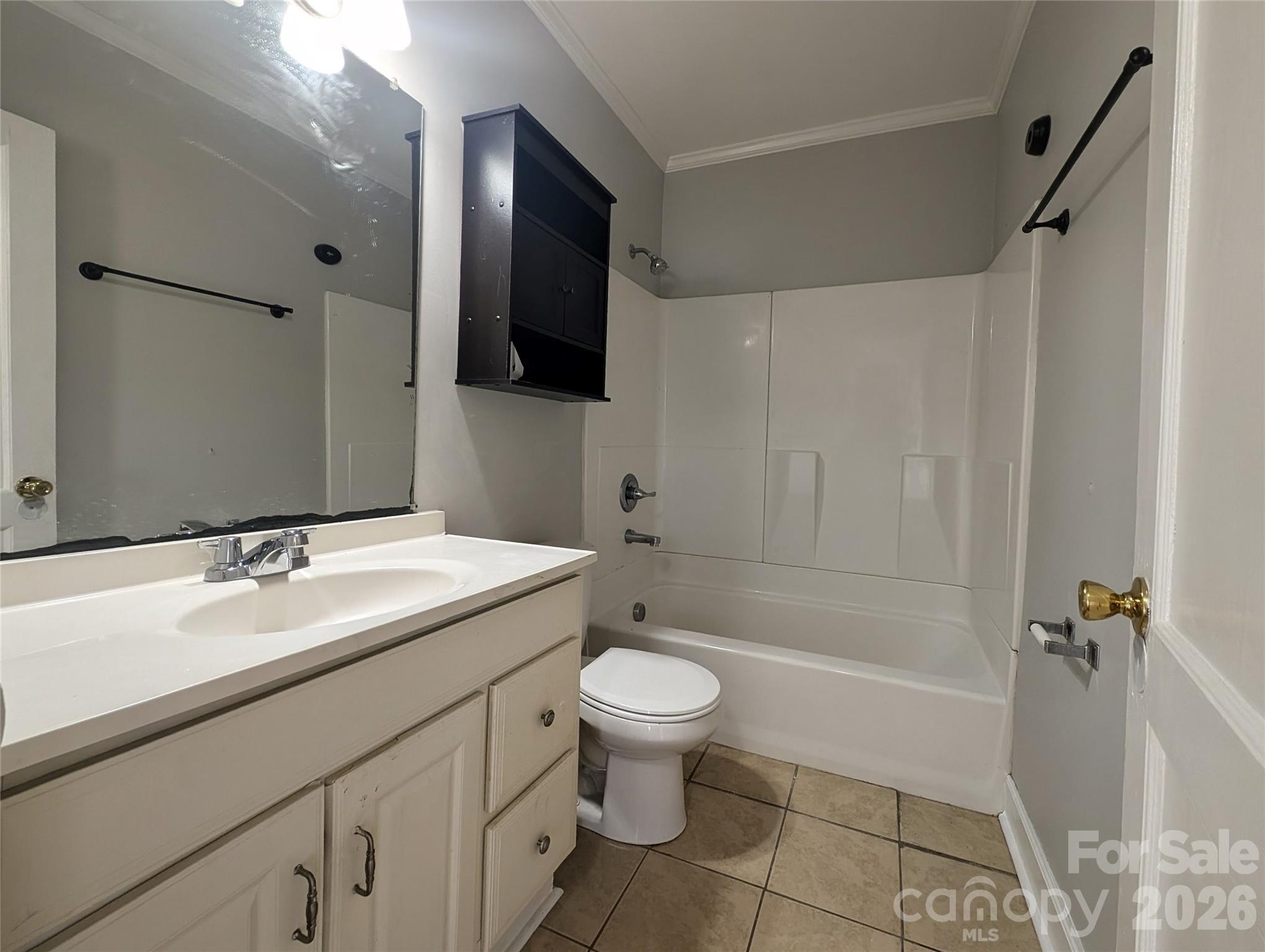 118 Brown Street Lake City, SC 29560 - Photo 7 of 12 a bathroom with a sink a toilet and shower