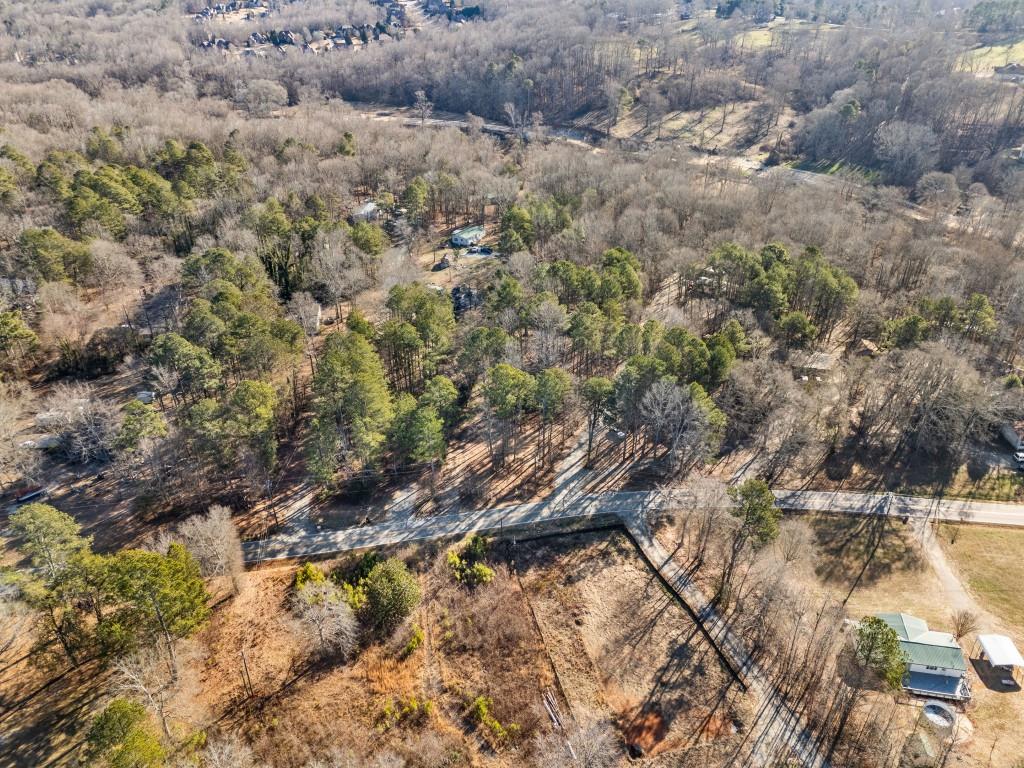 5590 John Burruss Road Cumming, GA 30040 - Photo 2 of 17 a view of a dry yard with green space