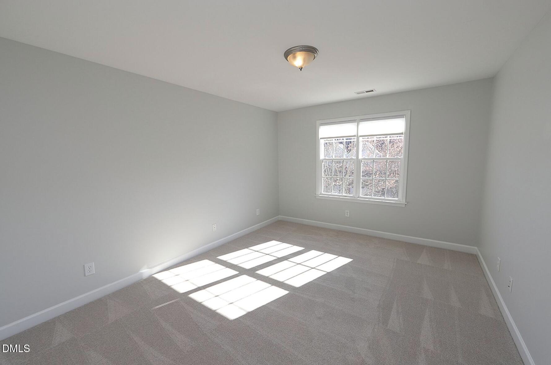5947 Four Townes Lane Raleigh, NC 27616 - Photo 11 of 13 an empty room with windows