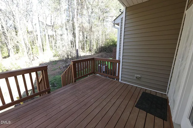 a view of backyard with a deck