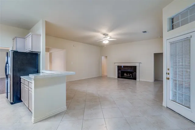 a kitchen with a stove a sink and a refrigerator
