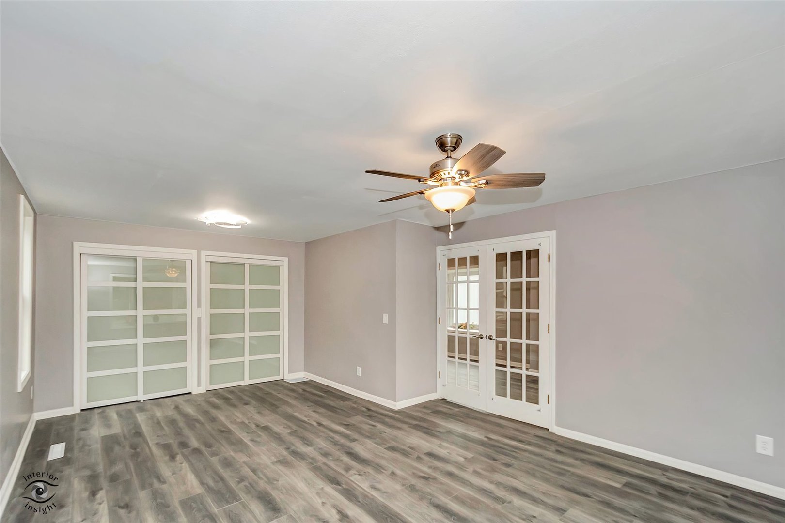 1032 South E Avenue Kankakee, IL 60901 - Photo 12 of 29 a view of an empty room with a window and wooden floor