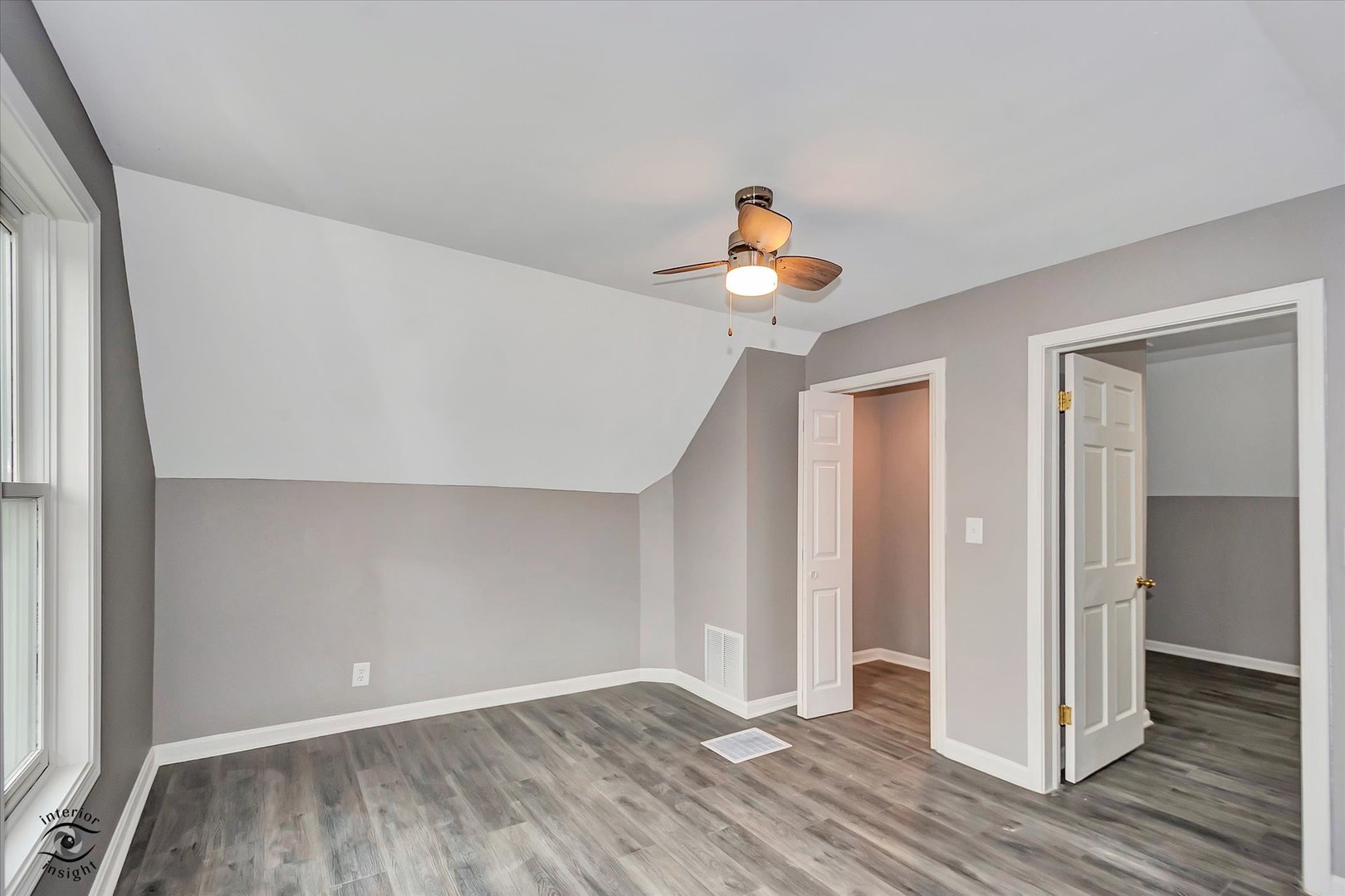 1032 South E Avenue Kankakee, IL 60901 - Photo 22 of 29 a view of a livingroom with wooden floor and a flat screen tv
