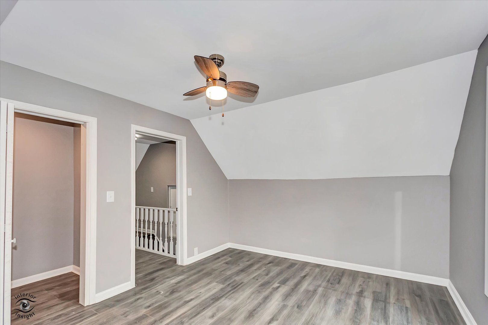 1032 South E Avenue Kankakee, IL 60901 - Photo 23 of 29 a view of a room with wooden floor and white walls