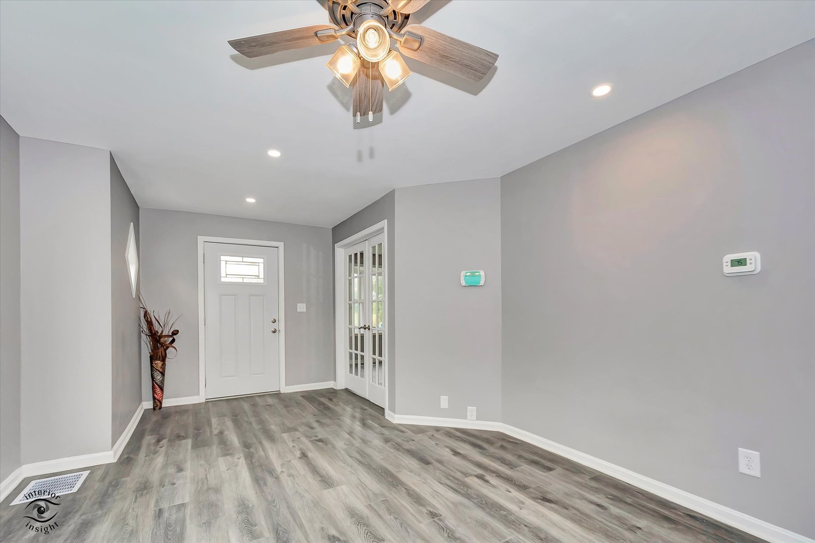 1032 South E Avenue Kankakee, IL 60901 - Photo 3 of 29 wooden floor in an empty room with a window