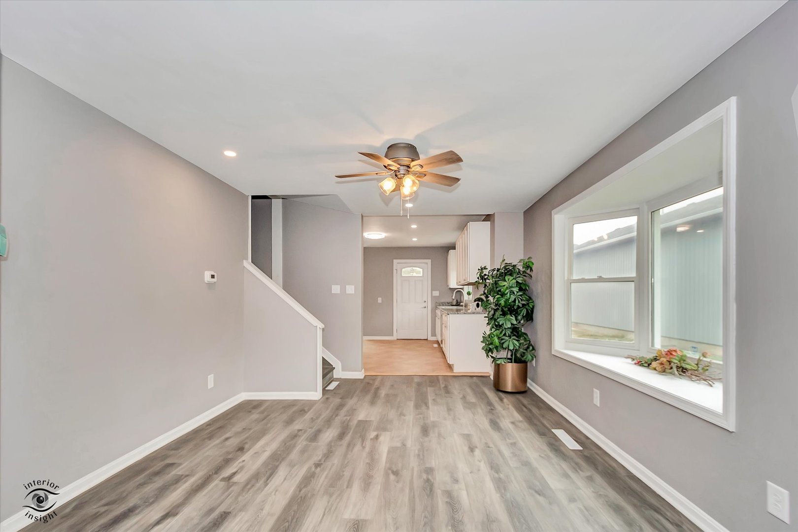 1032 South E Avenue Kankakee, IL 60901 - Photo 4 of 29 a view of an empty room and window and wooden floor