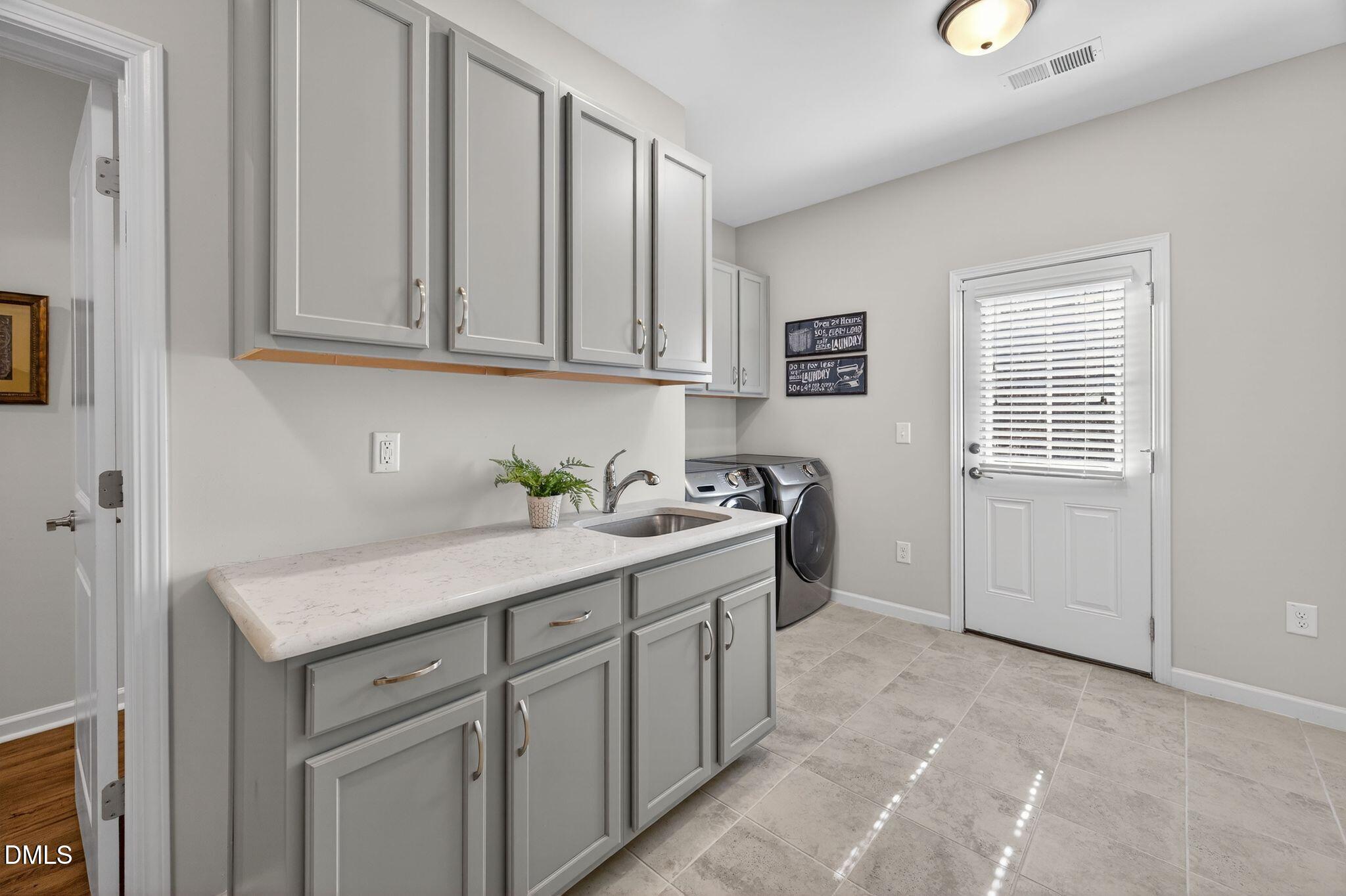 528 Spring Flower Court Cary, NC 27511 - Photo 30 of 51 a room with a sink cabinets and a window