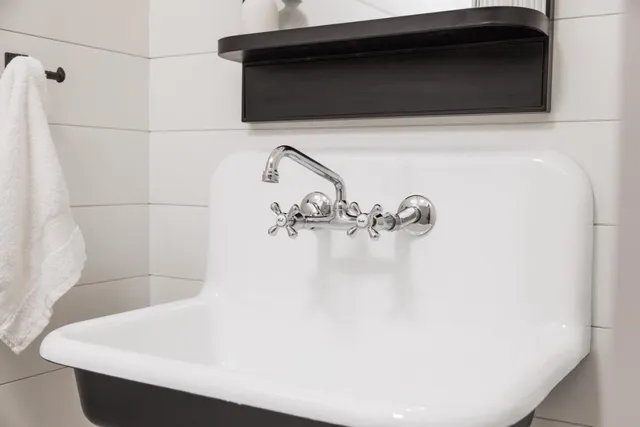a view of kitchen sink and cabinets